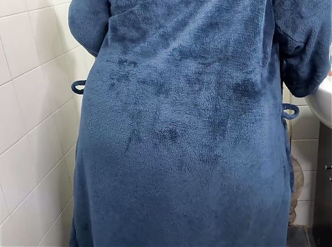 Fat granny undresses to take a shower